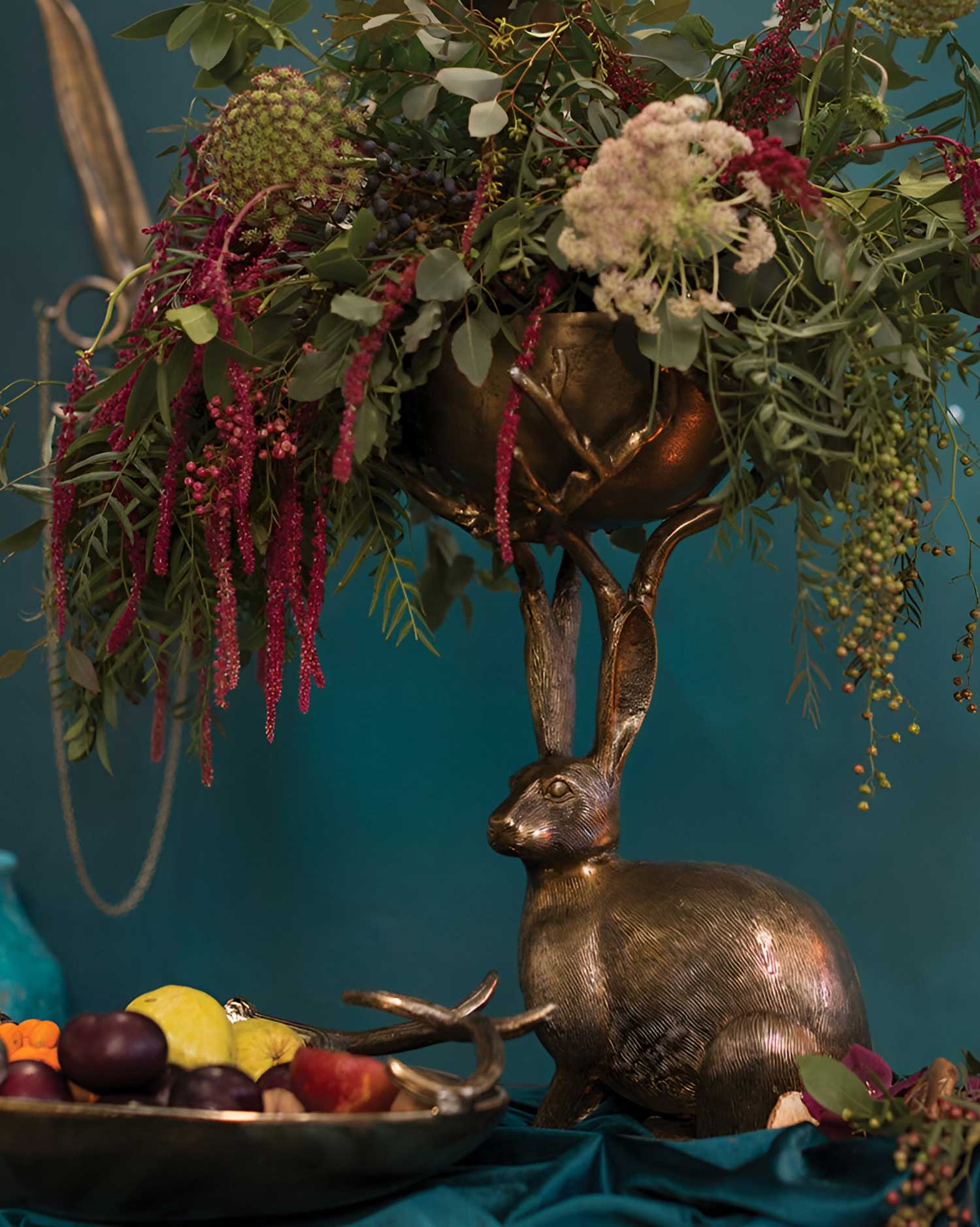 Fantastical Hare Branch Bowl filled with flowers on a table
